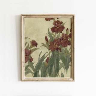 An art print featuring a painting of red irises with green leaves