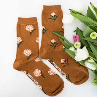A pair of mismatched socks with a floral pattern