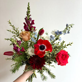 Bouquet of red, burgundy, white and blue flowers