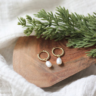 Gold hoop earrings with pearl drops 