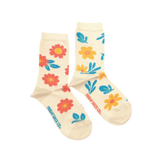 A pair of mismatched socks with a floral pattern